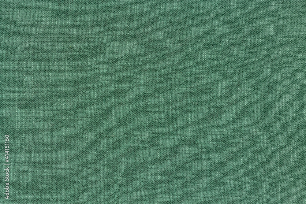 Fototapeta premium Surface of cotton linen tablecloth kitchen (napkin) green color texture background.