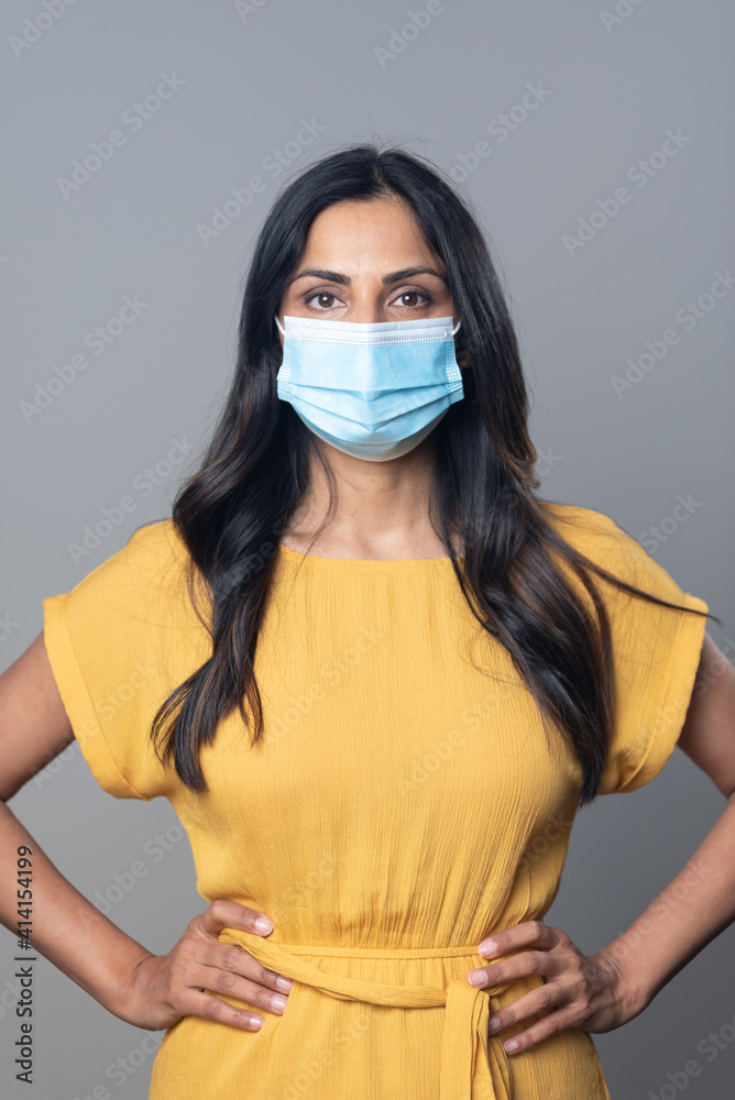 Beautiful Asian Indian woman wearing a protective mask.