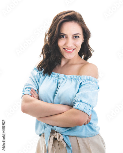 Friendly young woman with crossed arms, isolated on white background. Pretty girl with smile expression looking to camera © Alen-D