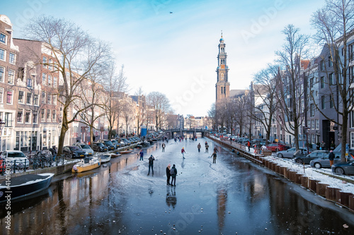 Photography Amsterdam Netherlands February 2021,Ice skating on the canals in Amsterdam the Netherlands in winter, frozen canals in Amsterdam during winter