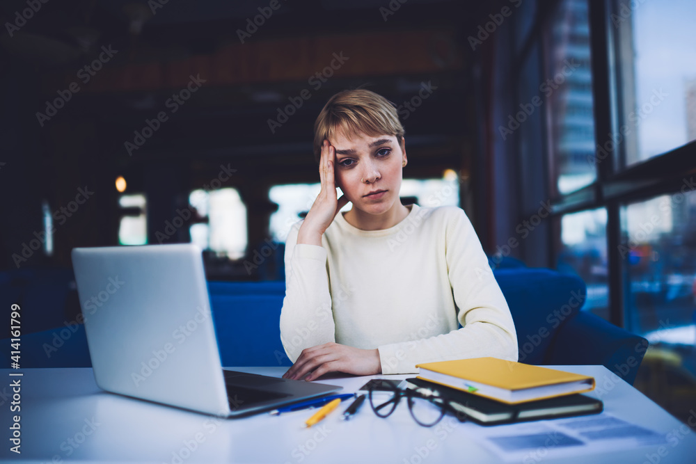 Tired woman with laptop during work on deadline Tired woman with laptop during work on deadline
