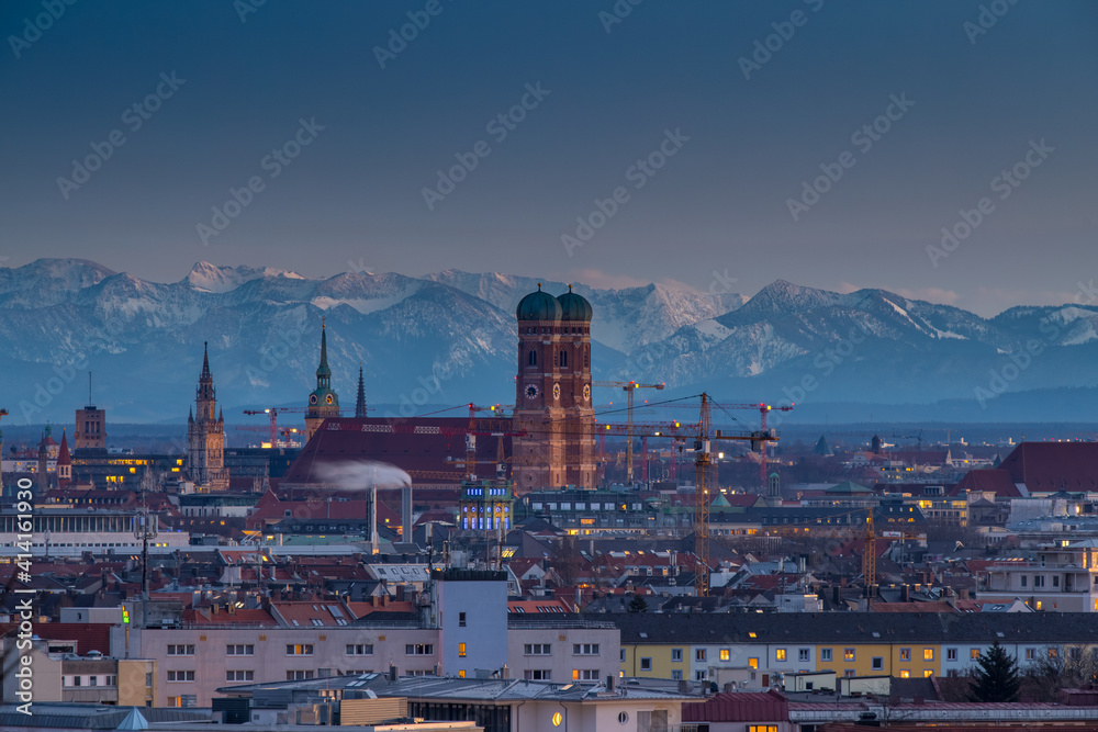 Fototapeta premium Munich night skyline aerial ina background pre alps moinutains