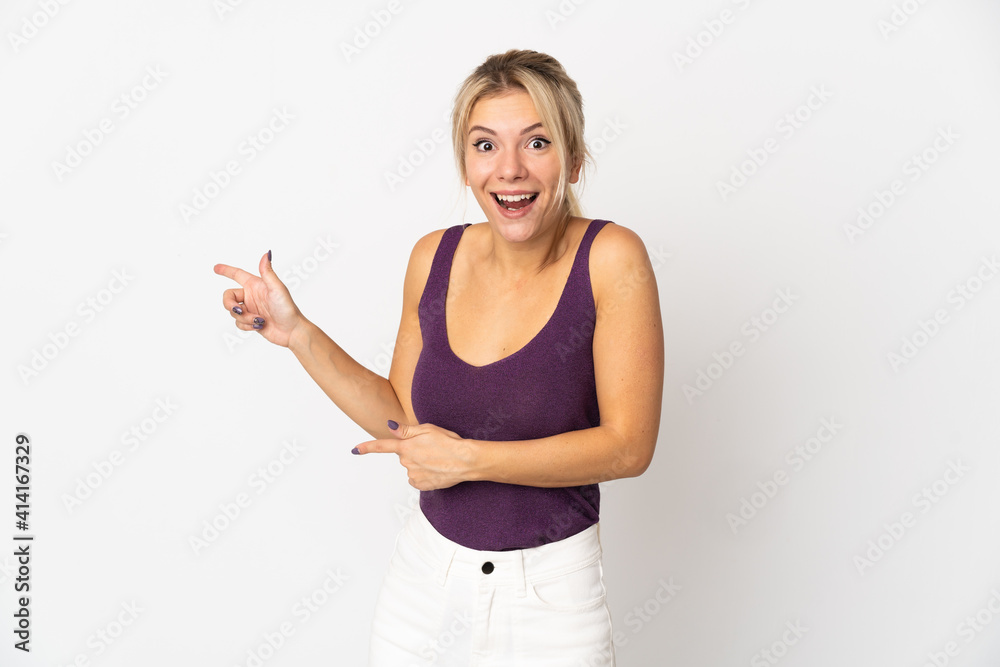 Young Russian woman isolated on white background surprised and pointing side Young Russian woman isolated on white background surprised and pointing side