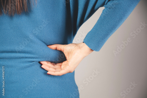 woman hand belly fats © Alla