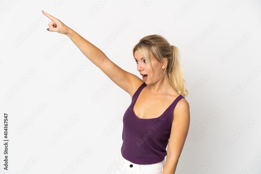 Young Russian woman isolated on white background pointing away Young Russian woman isolated on white background pointing away
