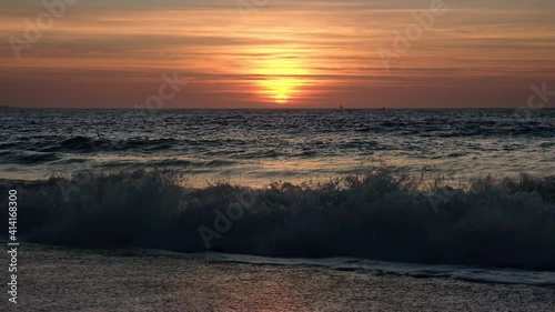 Beautiful sunset at the sea. Sea surf and waves