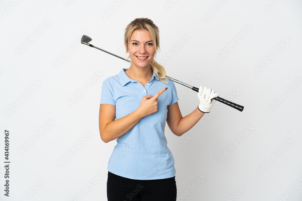 Young Russian golfer woman isolated on white background pointing to the side to present a product Young Russian golfer woman isolated on white background pointing to the side to present a product