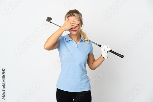 Young Russian golfer woman isolated on white background covering eyes by hands. Do not want to see something