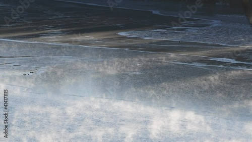 fog at the river enns in upper austria on a very cold morning in februrary photo