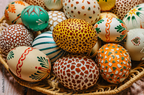 Happy Easter.Colorful hand painted decorated Easter eggs. Handmade Easter craft.Spring decoration background. DIY Festive traditional symbols.Holiday Still life photo selective focus.
