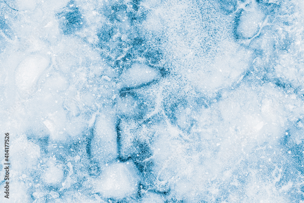 Ice texture blue background. Textured cold frosty surface of ice.