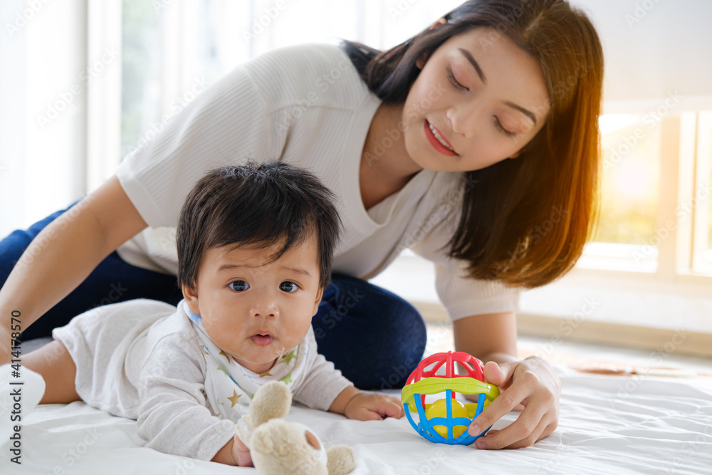 Mom playing with her son nursery at home in the morning Mom playing with her son nursery at home in the morning