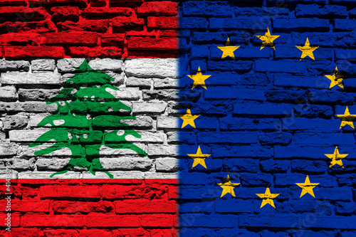 Flag of Lebanon and Europe on brick wall