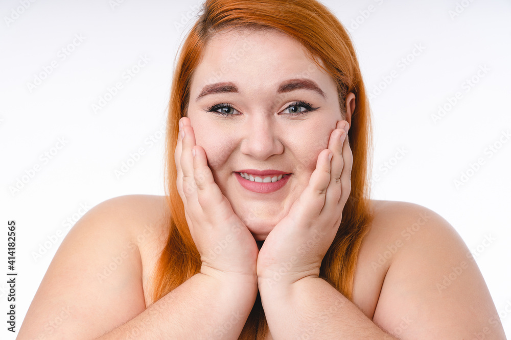 Cropped shot of a young ginger-haired plump woman with healthy skin isolated over white background Cropped shot of a young ginger-haired plump woman with healthy skin isolated over white background