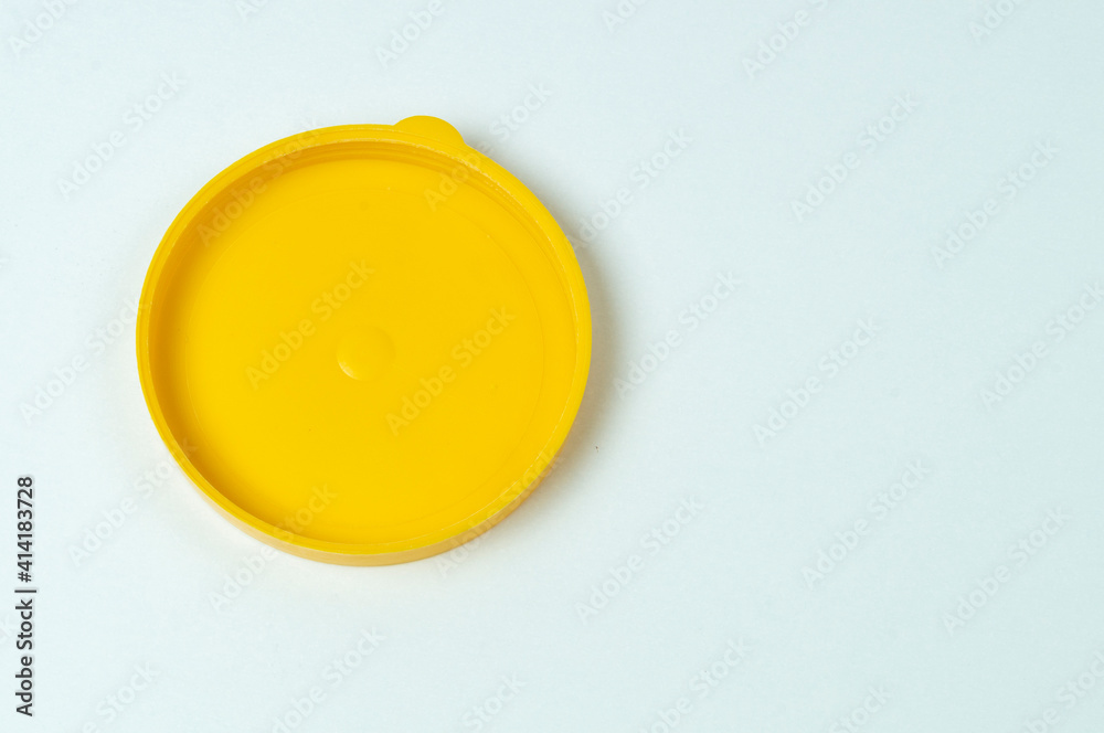 yellow plastic lid on white background for glass jar, blank for design