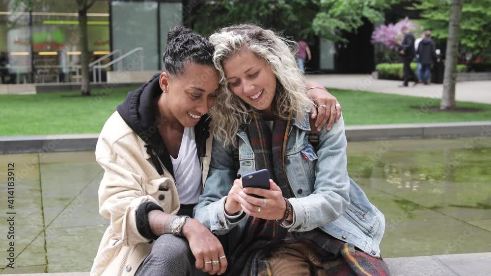 Happy mixed race girlfriends taking a selfie in London - Lesbian couple, millennials women, having fun together in London - LGBTQ concept with multiracial beautiful couple Happy mixed race girlfriends taking a selfie in London - Lesbian couple, millennials women, having fun together in London - LGBTQ concept with multiracial beautiful couple