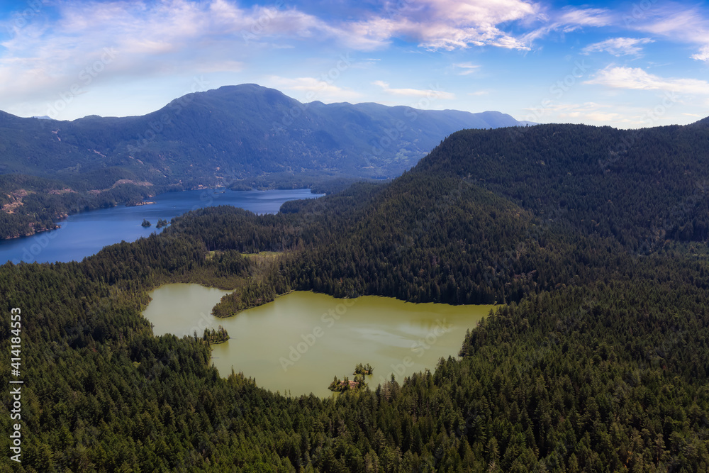 Aerial view of Ambrose Lake Ecological Reserve and Ruby Lake during a sunny summer. Colorful Sky Art Render. Taken in Sunshine Coast, BC, Canada.