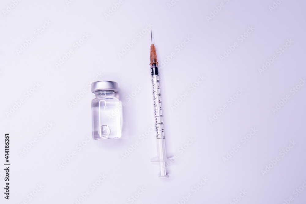 Medicine bottle for injection. Medical glass vials and syringe for vaccination. liquid drug or vaccine for treatment, flu in laboratory, hospital or pharmacy concept isolated on white background. Medicine bottle for injection. Medical glass vials and syringe for vaccination. liquid drug or vaccine for treatment, flu in laboratory, hospital or pharmacy concept isolated on white background.