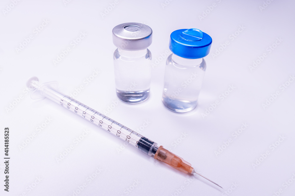 Medicine bottle for injection. Medical glass vials and syringe for vaccination. liquid drug or vaccine for treatment, flu in laboratory, hospital or pharmacy concept isolated on white background.