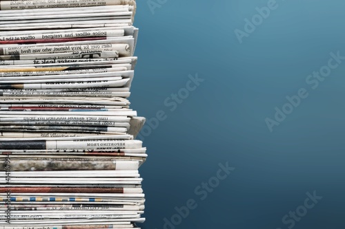 Pile of newspapers on background photo