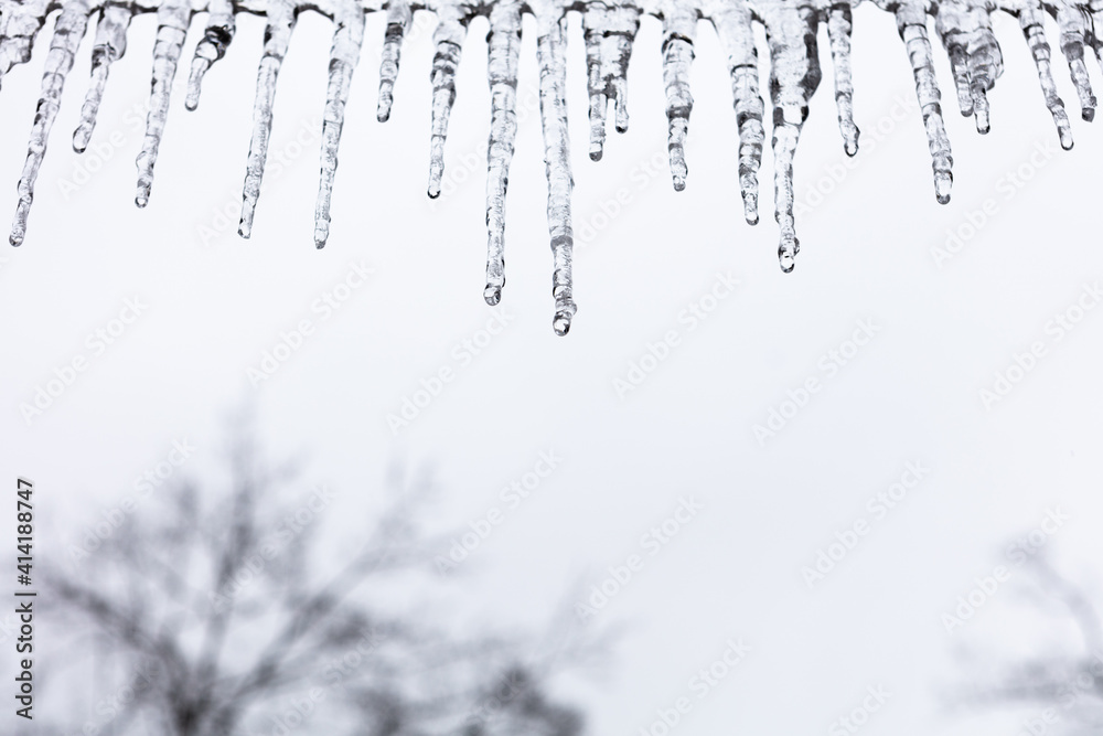 Icicles hangin from a roof line Icicles hangin from a roof line