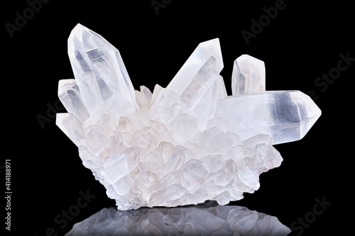 Amazing pure Quartz Crystal cluster gemstone closeup macro isolated on black background. Natural rare white mineral rough stone. Beautiful crystals arrangement