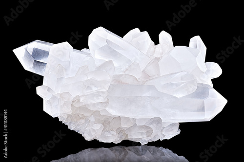 Amazing pure Quartz Crystal cluster gemstone closeup macro isolated on black background. Natural rare white mineral rough stone. Beautiful crystals arrangement