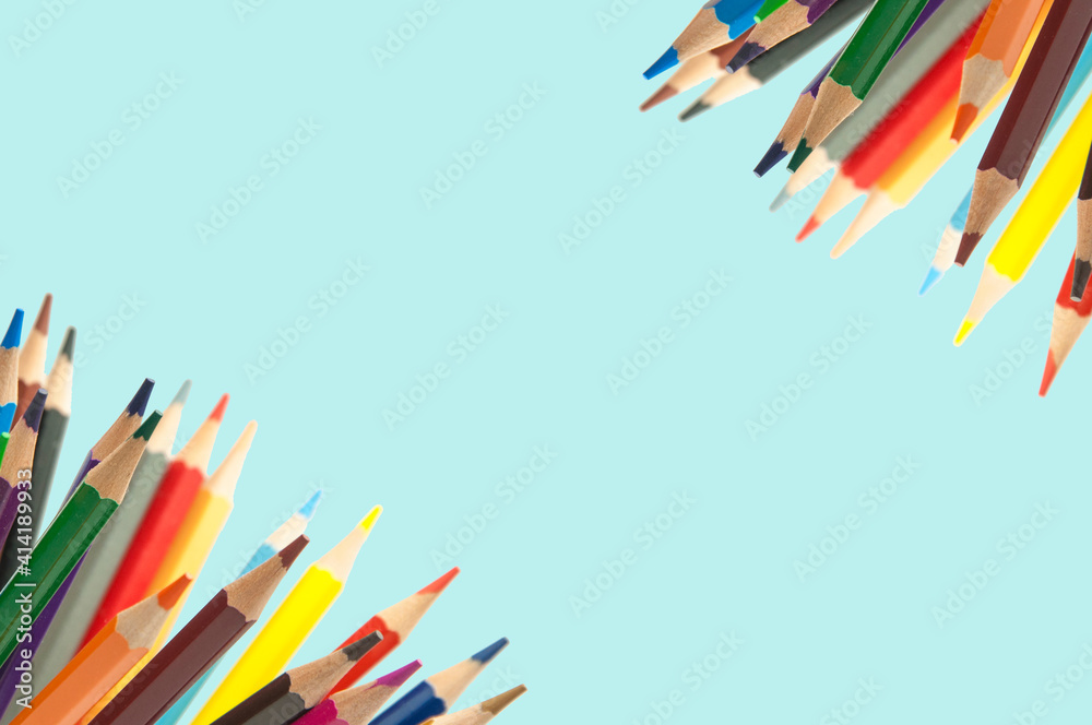 Fototapeta premium colored pencils on a blue background. education concept. illustration of training.