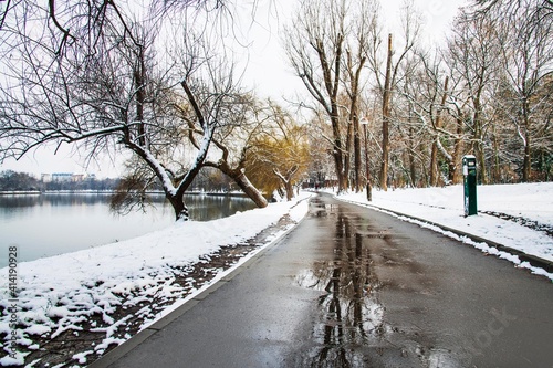 Snow time winter landscape at Herastrau park, Bucharest. Snow is falling, cold day. Beautiful day