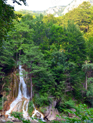 Beautiful scenery of the Valul Miresei waterfall in Romania photo