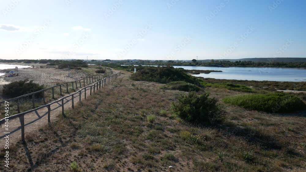 Beautiful view of Salina dei Monaci, old salt pans in the Salento coastal area, Torre Colimena, Manduria, Taranto, Apulia, Italy Beautiful view of Salina dei Monaci, old salt pans in the Salento coastal area, Torre Colimena, Manduria, Taranto, Apulia, Italy