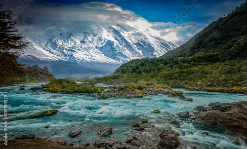 big river with snow mountain in the background in Patagonia, Chile