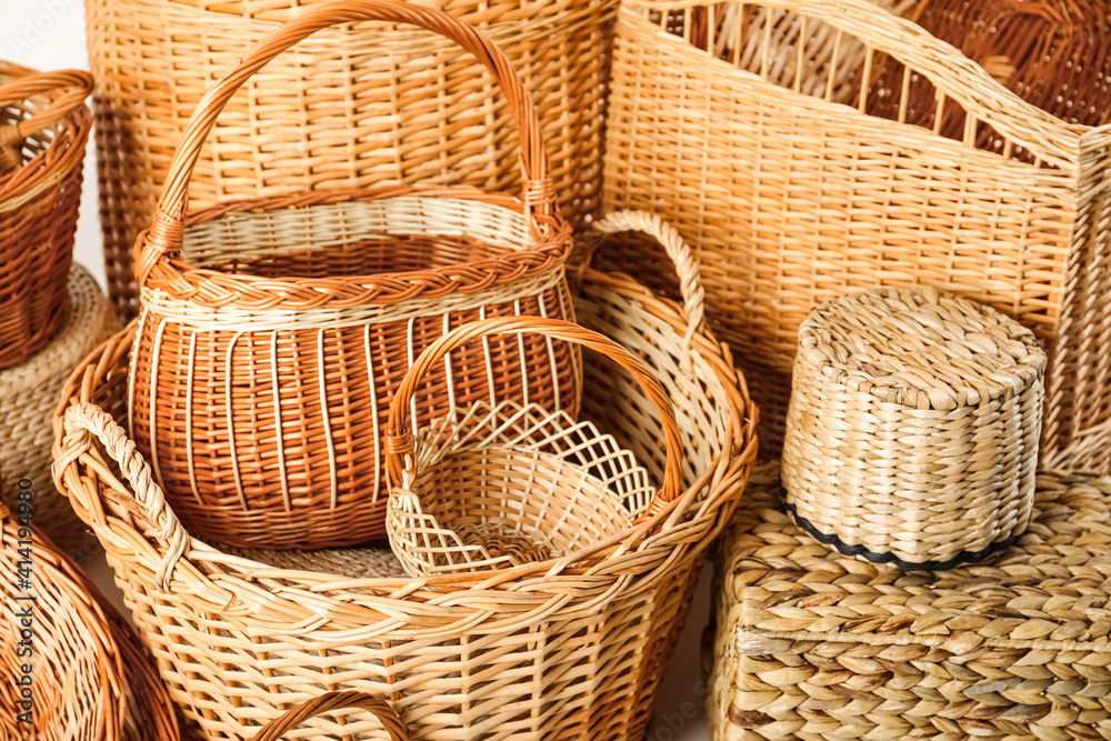 Many different wicker baskets made of natural material as background Many different wicker baskets made of natural material as background
