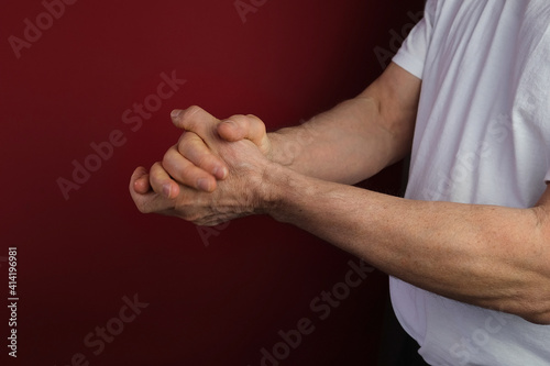 close-up of middle-aged male hand, applying a moisturizing, rejuvenating hand cream, disinfection of skin during viral epidemic, medical, cosmetology concept