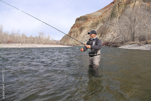 Fly fisherman casting for steelhead trout on the Salmon River in Idaho