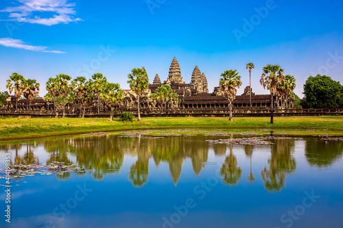 Beautiful landscape of the ancient city of Angkor Wat in Cambodia. Towers of the temple of the Kmer people with reflection in the lake. The concept of travel to the sights of ancient civilizations. © Vera