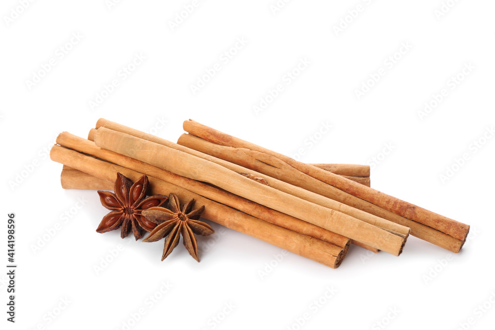 Aromatic cinnamon sticks and anise isolated on white