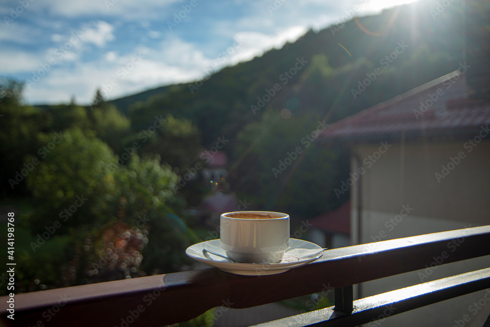 cup of coffee on the terrace, a cup of coffee in the morning against the background of nature, romantic breakfasts, coffee by the window, morning drink, healthy lifestyle