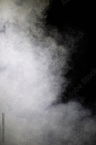 Artificial fog and haze on a dark background of the scene.