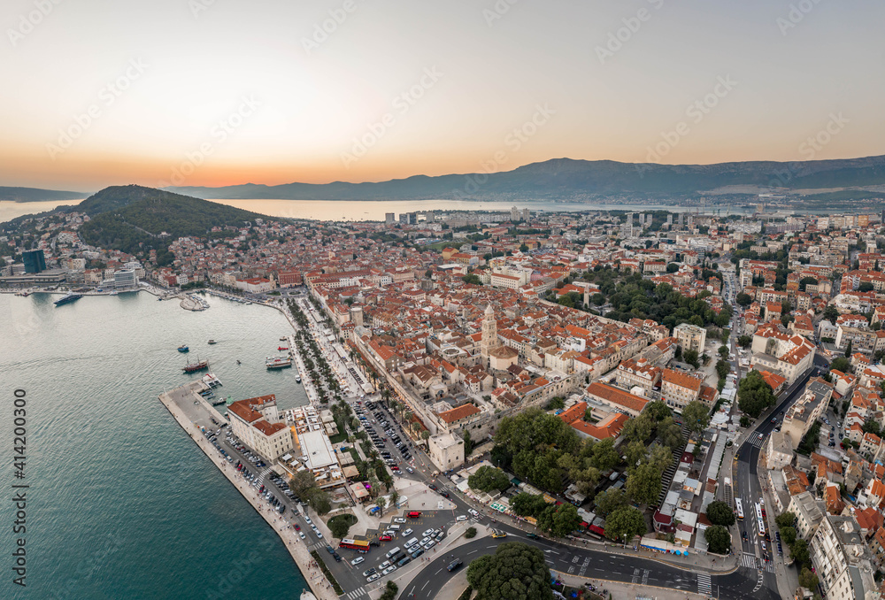 Aerial drone shot of Diocletian Palace by port riva in Split old town in sunset in Croatia