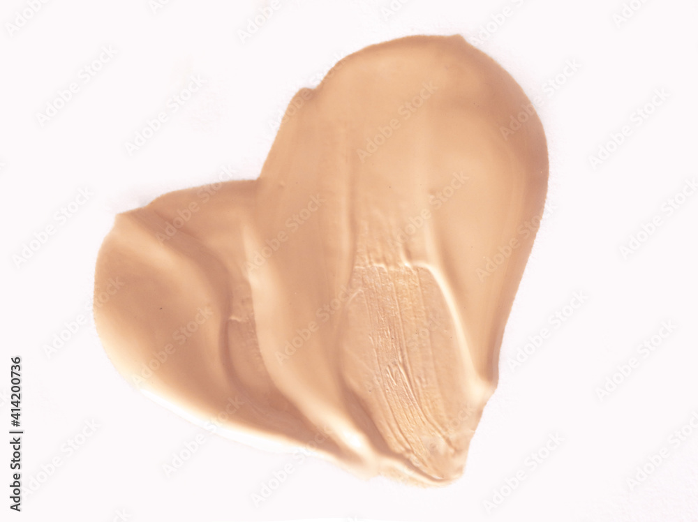 Fototapeta premium Foundation smear on a white background. A speck of makeup isolated.