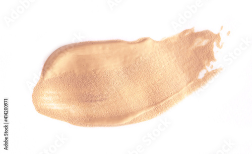 Foundation smear on a white background. A speck of makeup isolated.