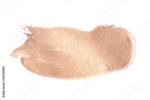 Foundation smear on a white background. A speck of makeup isolated.
