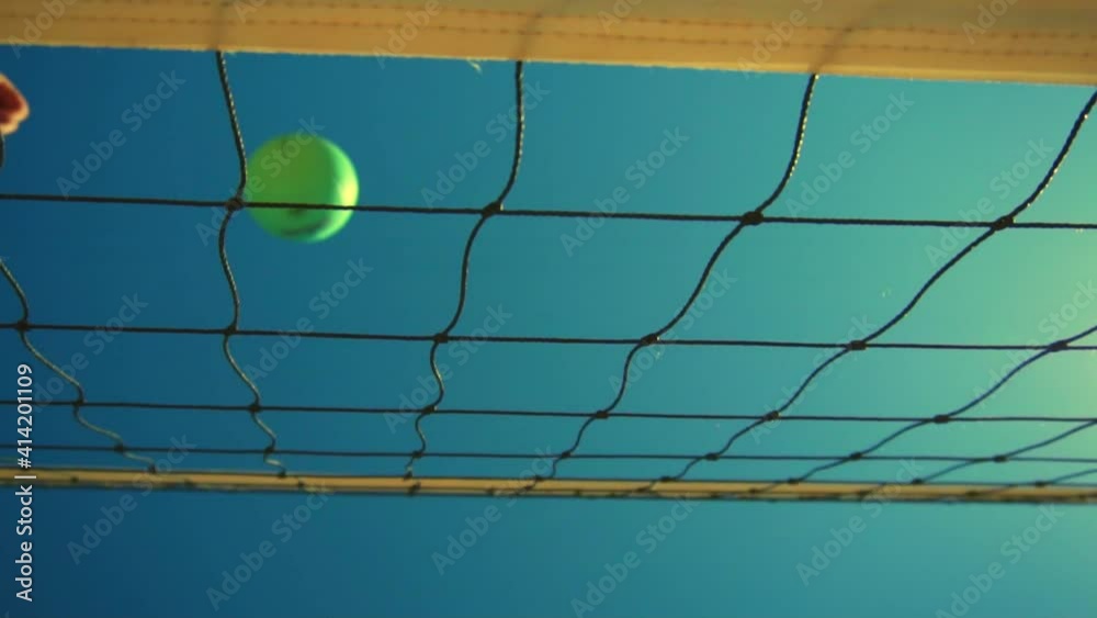 Volleyball player spikes the ball. Beach volleyball Volleyball player spikes the ball. Beach volleyball