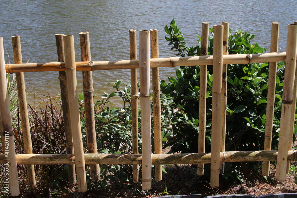 Bamboo fencing tied to posts Bamboo fencing tied to posts