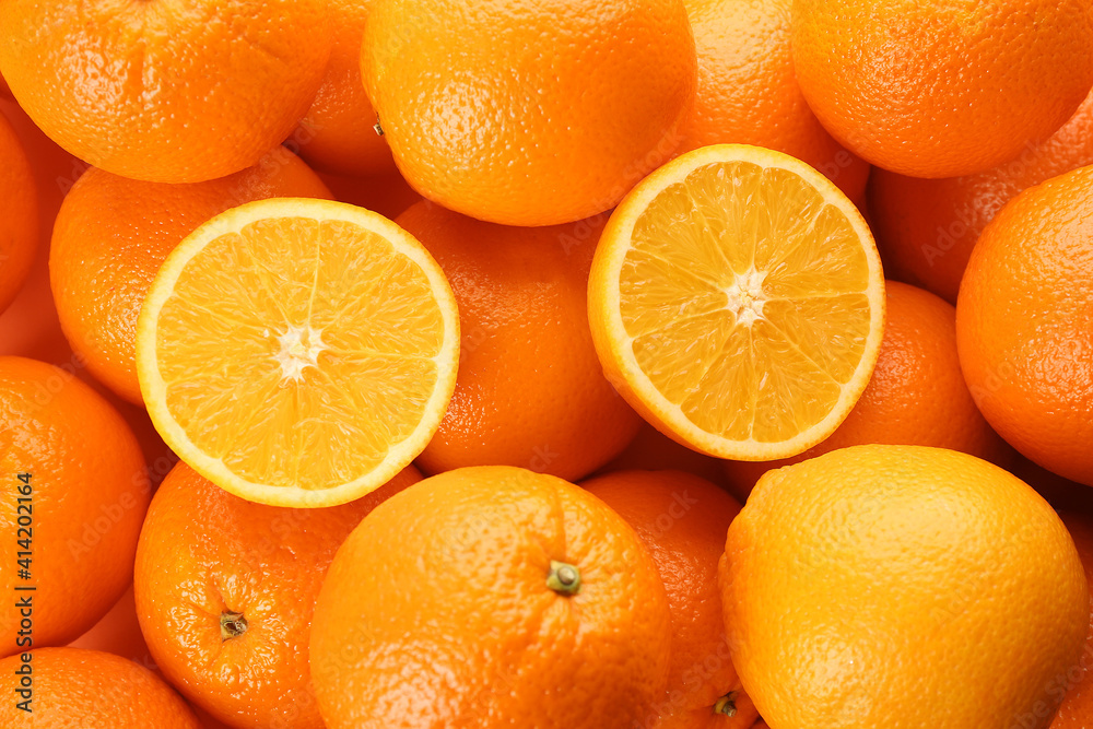 Cut and whole fresh ripe oranges as background, top view Cut and whole fresh ripe oranges as background, top view