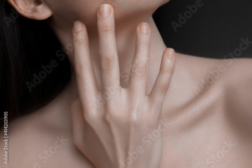 Woman neck and chin touching neck. Smooth skin