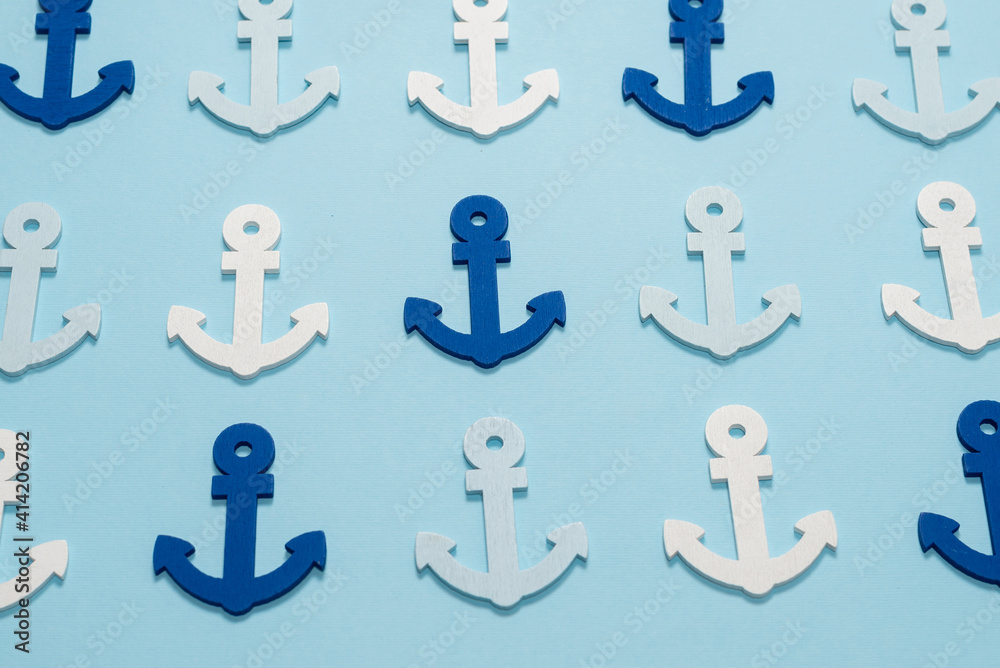 Blue anchors on a blue background. Blue anchors on a blue background.