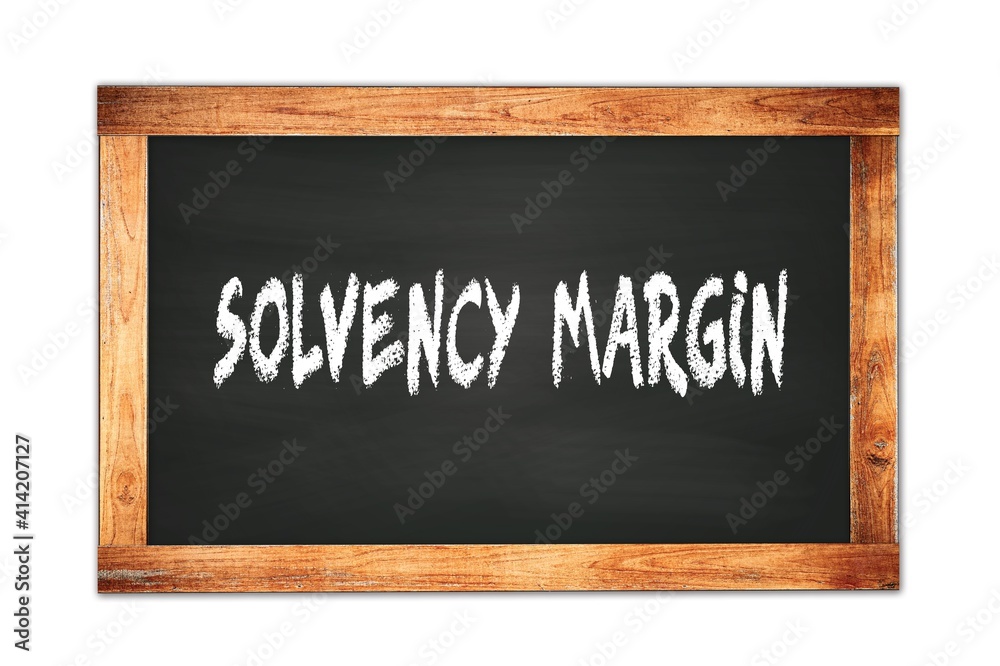 SOLVENCY  MARGIN text written on wooden frame school blackboard.