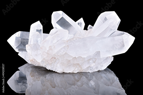 Amazing pure Quartz Crystal cluster gemstone closeup macro isolated on black background. Natural rare white mineral rough stone. Beautiful crystals arrangement